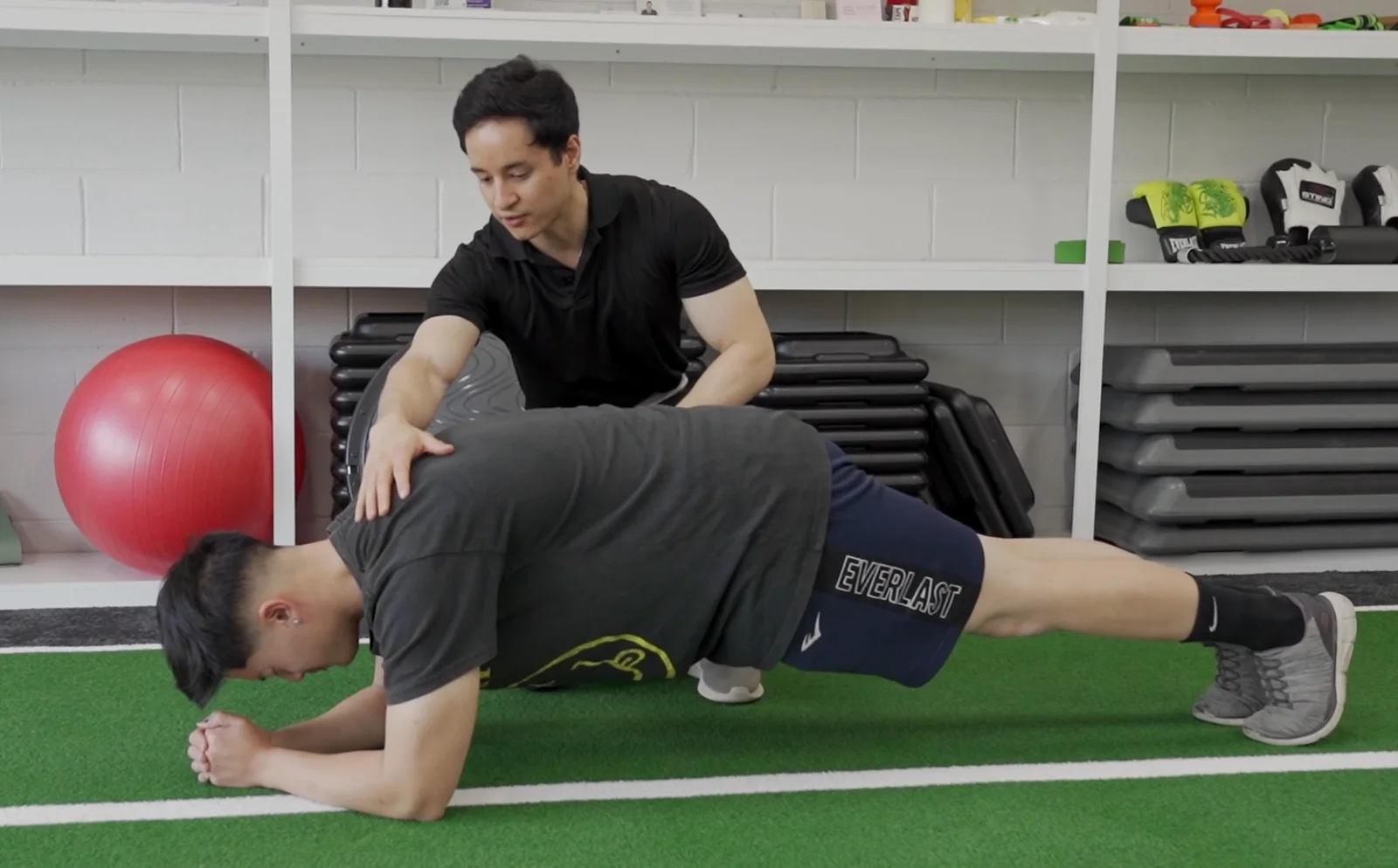 Ramon guiding a client through a movement exercise